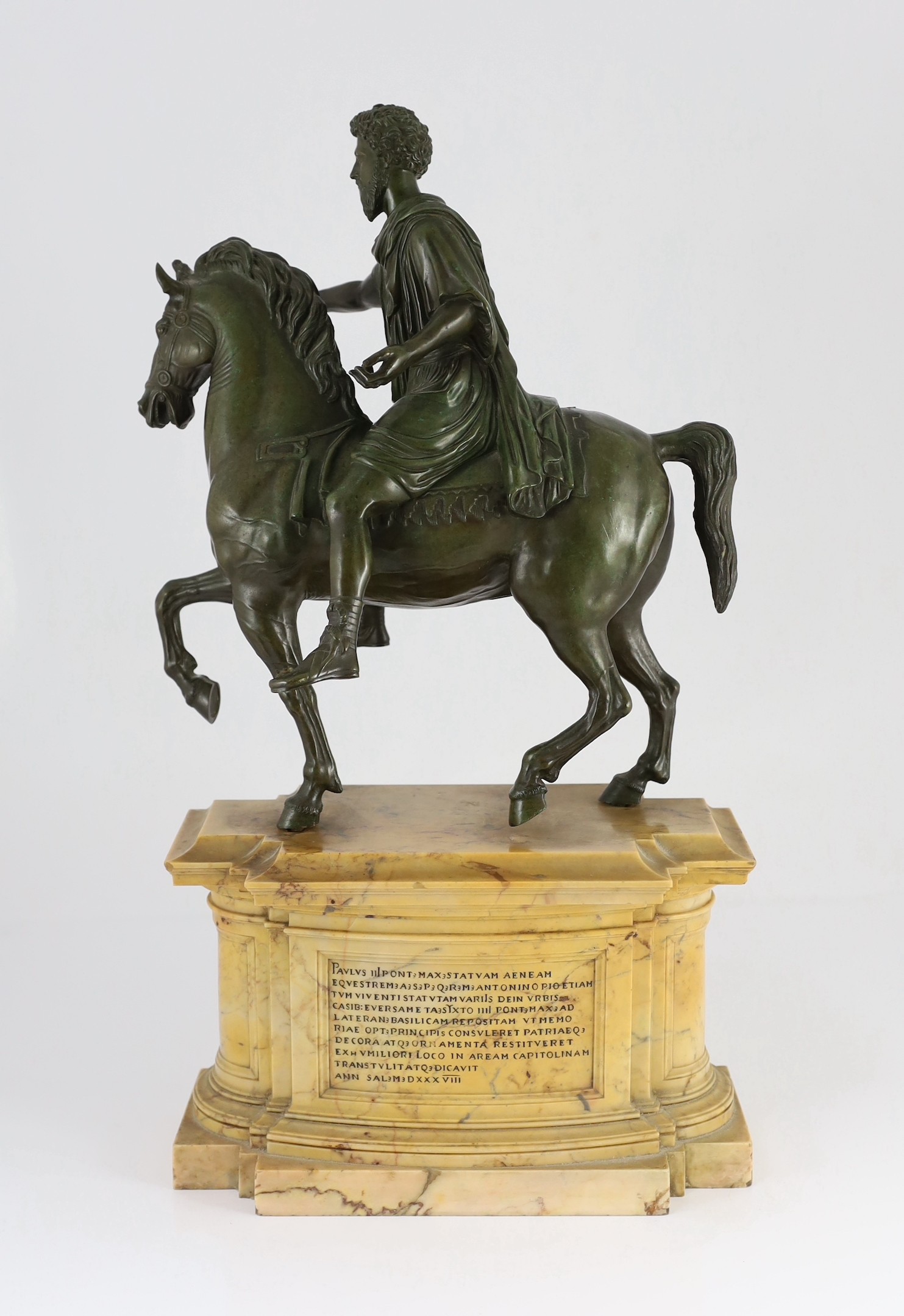 After the Antique. A 19th century Italian Grand Tour bronze equestrian group, modelled as Emperor Marcus Aurelius on horseback, 31cm wide, 16cm deep, overall 57cm high